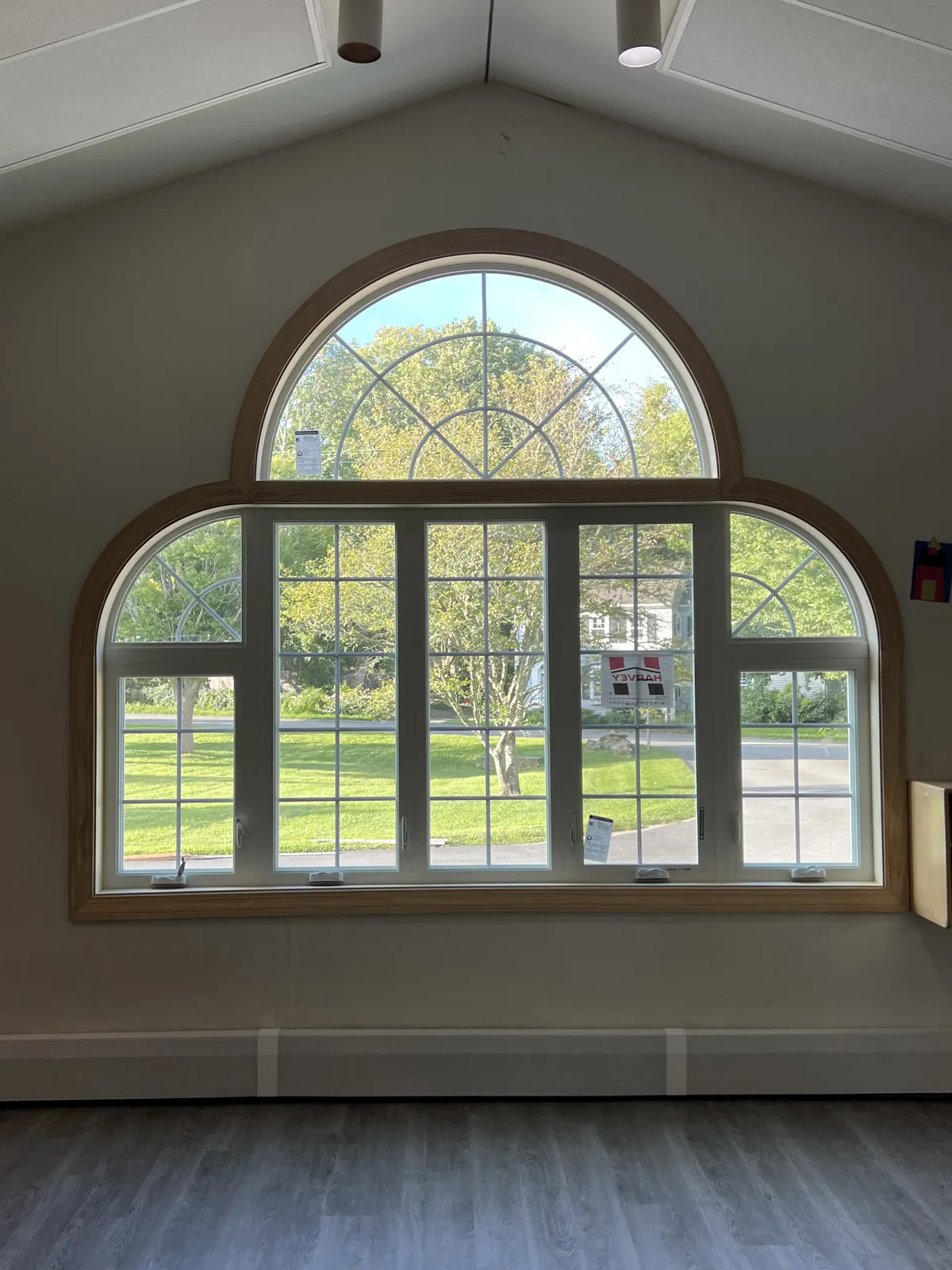 Interior arched palladian window overlooking a lawn