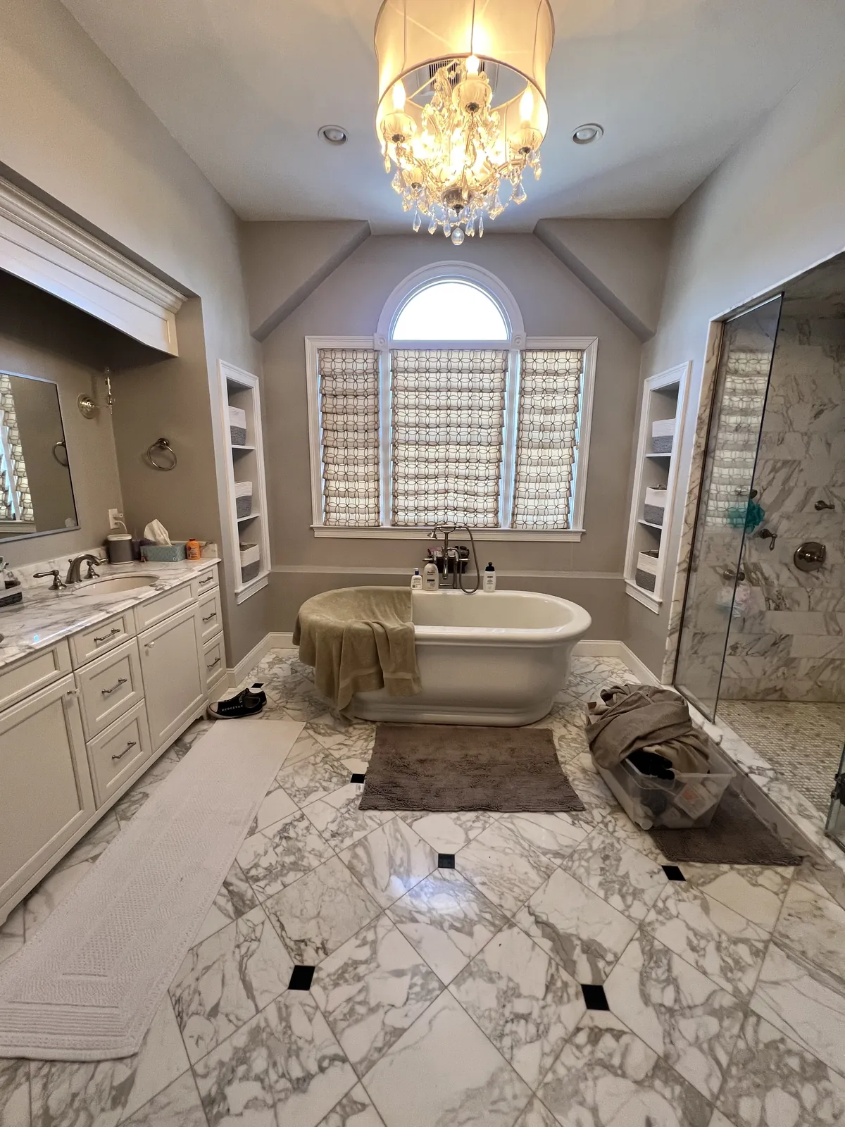 Renovated bathroom with soaking tub and glass block windows