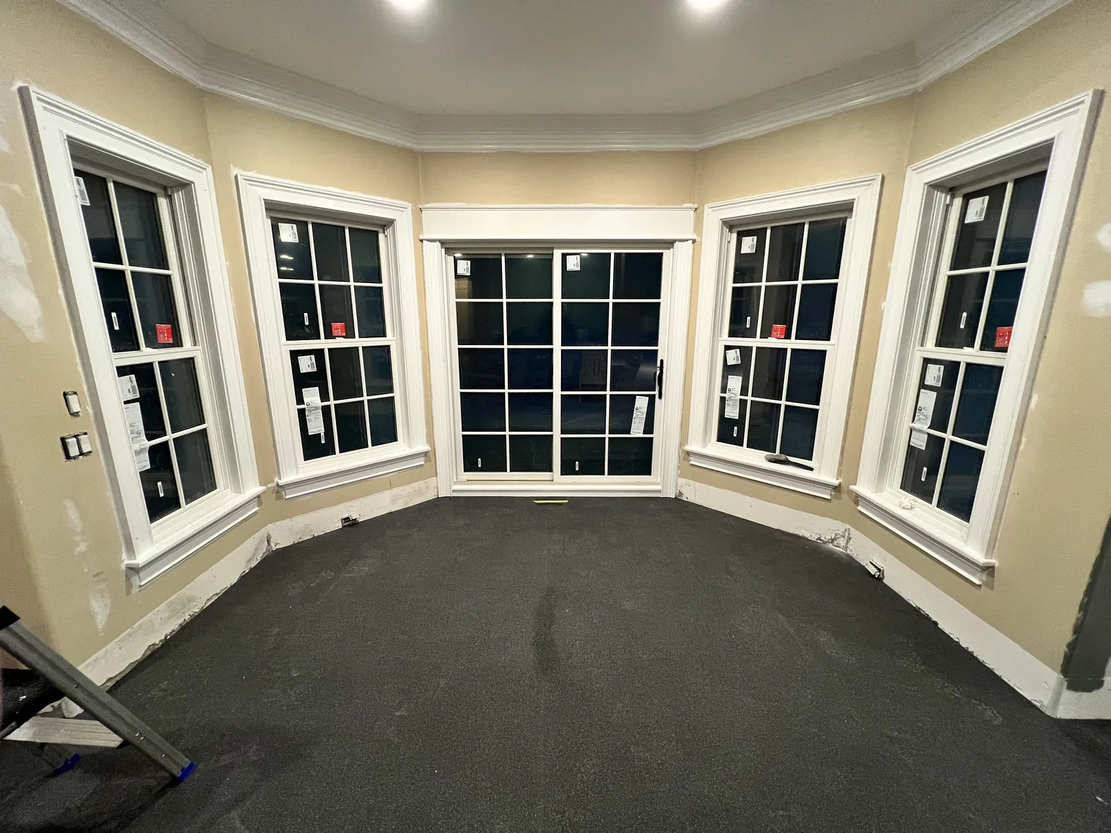 Curved bay window wall wrapping a newly finished room