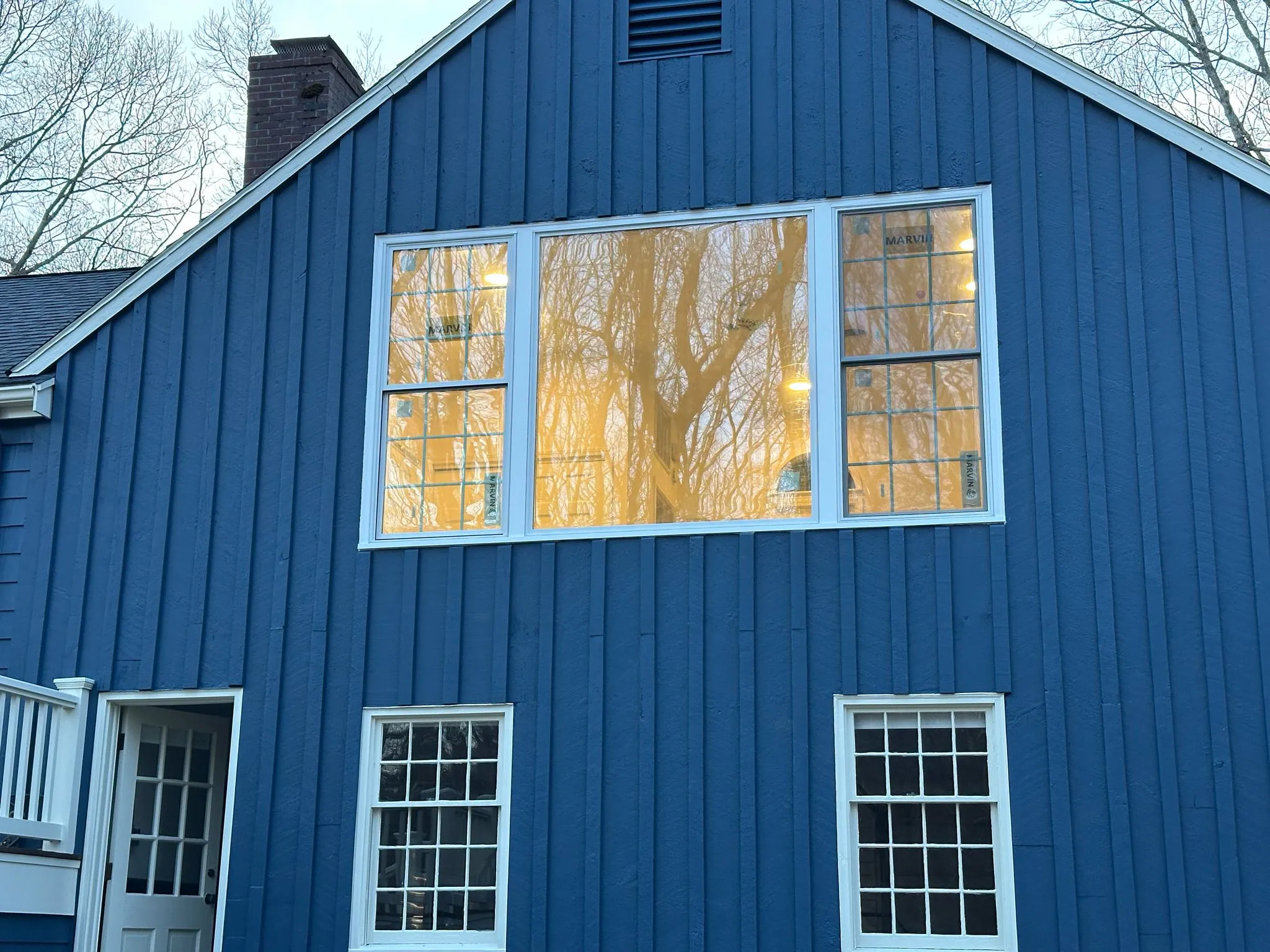Sunroom interior with new windows and vaulted ceiling